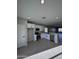 Modern kitchen with white cabinets and stainless steel appliances at 15494 S Kline Pl, Arizona City, AZ 85123