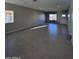 Spacious living room featuring tile floors and large windows at 15494 S Kline Pl, Arizona City, AZ 85123