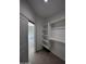 Bright walk-in closet with built-in shelving and rods at 15494 S Kline Pl, Arizona City, AZ 85123
