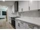 Modern kitchen with white cabinets, a stainless steel range, and contemporary backsplash at 16235 E Stancrest Dr, Fountain Hills, AZ 85268