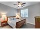 Cozy bedroom with wood bed frame and ceiling fan at 16731 S 181St Ave, Goodyear, AZ 85338