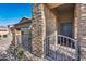 Inviting front entrance with stone accents and iron gate at 16731 S 181St Ave, Goodyear, AZ 85338