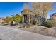 Landscaped front yard with stone and drought-tolerant plants at 16731 S 181St Ave, Goodyear, AZ 85338