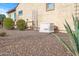Landscaped backyard with desert plants and a generator at 18852 N 260Th Ln, Buckeye, AZ 85396