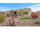 Backyard features a covered patio and desert landscaping at 18852 N 260Th Ln, Buckeye, AZ 85396