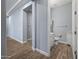 Small bathroom with toilet, vanity, and white cabinets at 18852 N 260Th Ln, Buckeye, AZ 85396