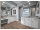 Large bathroom with dual vanities, granite countertops, and a walk-in shower at 18852 N 260Th Ln, Buckeye, AZ 85396