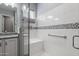 Spa-like bathroom with a walk-in shower and a built-in seat at 18852 N 260Th Ln, Buckeye, AZ 85396