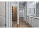 Main bathroom with a large closet and double vanity at 18852 N 260Th Ln, Buckeye, AZ 85396