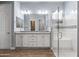 Elegant bathroom featuring a double vanity and a large glass shower at 18852 N 260Th Ln, Buckeye, AZ 85396