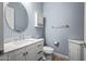 Bathroom with single vanity, toilet and corner cabinet at 18852 N 260Th Ln, Buckeye, AZ 85396
