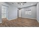 Spacious bedroom with en-suite bathroom and ceiling fan at 18852 N 260Th Ln, Buckeye, AZ 85396