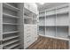 Large walk-in closet with ample shelving and hanging space at 18852 N 260Th Ln, Buckeye, AZ 85396
