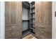 Large walk-in closet with ample shelving and hanging space at 18852 N 260Th Ln, Buckeye, AZ 85396