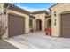 View of a home's front courtyard, featuring tile flooring and potted plants at 18852 N 260Th Ln, Buckeye, AZ 85396