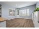 Bright dining area with built-in cabinetry and wood-look flooring at 18852 N 260Th Ln, Buckeye, AZ 85396