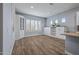 Bright dining area with built-in cabinetry and wood-look flooring at 18852 N 260Th Ln, Buckeye, AZ 85396