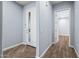 Bright entryway with wood-look flooring and interior doors at 18852 N 260Th Ln, Buckeye, AZ 85396