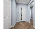 Bright entryway with wood-look flooring and interior doors at 18852 N 260Th Ln, Buckeye, AZ 85396