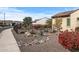 Landscaped front yard with drought-tolerant plants and a fence at 18852 N 260Th Ln, Buckeye, AZ 85396