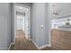 Hallway with view into a bedroom and kitchen at 18852 N 260Th Ln, Buckeye, AZ 85396
