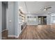 Open living area with fireplace, built-ins, and sliding glass doors at 18852 N 260Th Ln, Buckeye, AZ 85396
