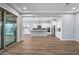 Open living room and kitchen with wood-look floors at 18852 N 260Th Ln, Buckeye, AZ 85396