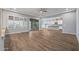 Open floor plan living room with kitchen and patio access at 18852 N 260Th Ln, Buckeye, AZ 85396