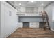 Bright office featuring built-in shelving, a Murphy bed, and a workspace at 18852 N 260Th Ln, Buckeye, AZ 85396