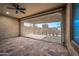 Covered patio with retractable shade and tile floor at 18852 N 260Th Ln, Buckeye, AZ 85396