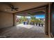 Covered patio with flagstone flooring and views of backyard at 18852 N 260Th Ln, Buckeye, AZ 85396