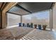Covered patio with modern pergola and sheer curtains at 18852 N 260Th Ln, Buckeye, AZ 85396