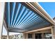 Modern pergola with adjustable louvers and lighting at 18852 N 260Th Ln, Buckeye, AZ 85396