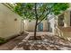 Bright courtyard with tiled patio and a central tree at 2152 E Calle Maderas --, Mesa, AZ 85213