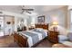 Bright bedroom with wood furniture and mirrored closet at 21605 N 147Th Dr, Sun City West, AZ 85375