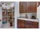 Walk-in pantry with ample shelving for food storage at 2330 E Brooks Farm Rd, Gilbert, AZ 85298