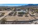 Aerial view of property with a barn and riding arena at 26620 N 141St St, Scottsdale, AZ 85262