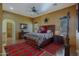 Large main bedroom with rustic wood bed frame and southwestern decor at 26620 N 141St St, Scottsdale, AZ 85262