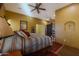 Main bedroom with a king-size bed and southwestern-themed decor at 26620 N 141St St, Scottsdale, AZ 85262