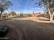 Large backyard with gravel and space for parking at 3206 W Garfield St, Phoenix, AZ 85009