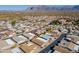 Aerial view of house and neighborhood, mountain backdrop at 3301 S Goldfield Rd # 2015, Apache Junction, AZ 85119