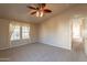 Bright bedroom with large windows and access to another room at 3301 S Goldfield Rd # 2015, Apache Junction, AZ 85119