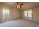 Bright bedroom with ceiling fan and access to bathroom at 3301 S Goldfield Rd # 2015, Apache Junction, AZ 85119