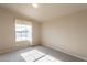 Simple bedroom with carpeted floor and a large window at 3301 S Goldfield Rd # 2015, Apache Junction, AZ 85119