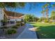 Landscaped pathway meanders through the community's green spaces at 3301 S Goldfield Rd # 2015, Apache Junction, AZ 85119