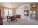 Spacious dining area with adjacent office space and hardwood floors at 3301 S Goldfield Rd # 2015, Apache Junction, AZ 85119