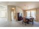 View of dining area, hallway, and kitchen with hardwood floors at 3301 S Goldfield Rd # 2015, Apache Junction, AZ 85119