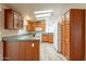 Kitchen with light wood cabinets, and a center island at 3301 S Goldfield Rd # 2015, Apache Junction, AZ 85119