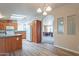 Open kitchen with island and view into dining area at 3301 S Goldfield Rd # 2015, Apache Junction, AZ 85119