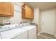 Laundry room with washer, dryer, and cabinets at 3301 S Goldfield Rd # 2015, Apache Junction, AZ 85119